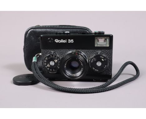 A Rollei 35 Compact Camera, black, made in Singapore, serial no 3280150, shutter working, meter responsive, body G-VG, with S