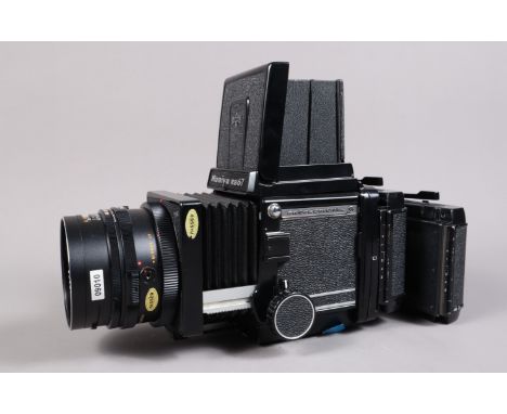 A Mamiya RB67 Professional S Camera, serial no C 221419, shutter working, body G-VG, some paint wear to back, bellows VG, wit