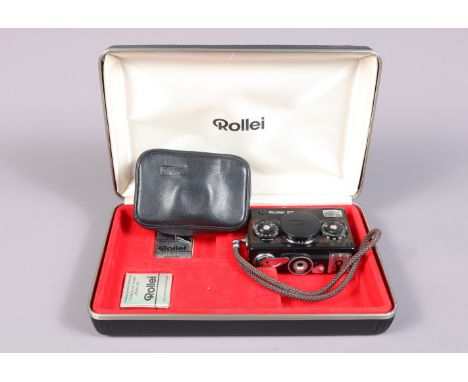 A Rollei 35 Compact Camera, black, brown, simulated Crocodile skin, made in Singapore, serial no 3267139, shutter working, me