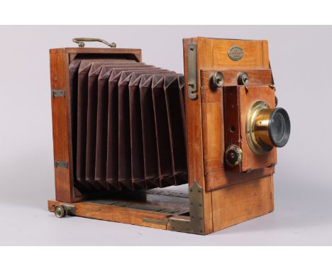 A Jules Reygondaud 7 x 5in Tailboard Camera, circa 1885, tapered chamfered-corner tan bellows, focusing screen present, Thorn