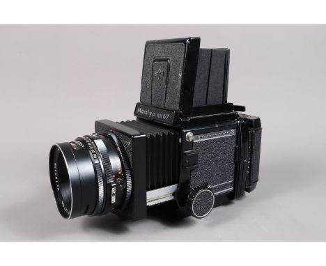 A Mamiya RB67 Professional S Camera, serial no C 514529, shutter working, body G, light wear, bellows VG, with waist level fi