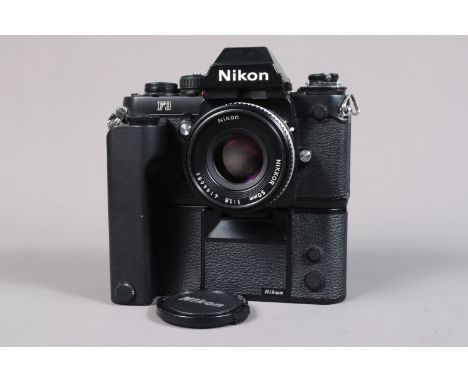 A Nikon F3 Camera, black, serial no 1733173, shutter working, self timer working, meter responsive, body G, slight brassing t