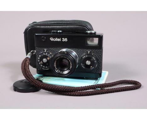 A Rollei 35 Compact Camera, black, made in Germany, serial no 3110705, shutter working, meter responsive, body G-VG, with Car