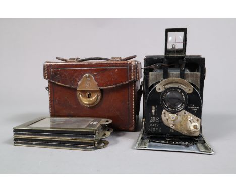 A Newman &amp; Guardia Baby Sibyl Camera, serial no B 801, Brit Pat 8721-2, Amer Pat 1088492, shutter working, body G, some b