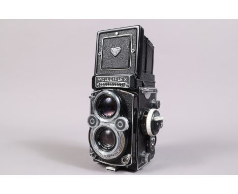 A Rolleiflex 3.5F TLR Camera, serial no 2217358, shutter working, meter responsive, body G, some brassing to front plate, som