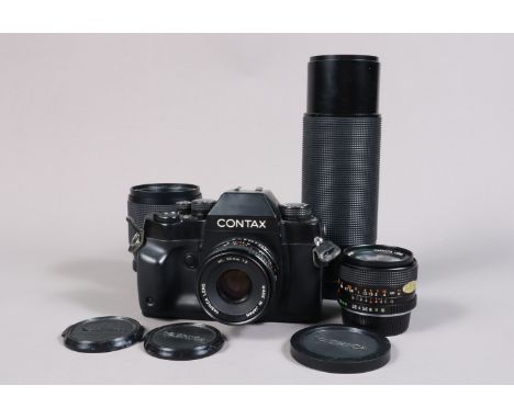 A Contax RX SLR Camera, serial no 026848, shutter working, meter responsive, body G, some wear, with Yashica 50mm f/2 ML lens