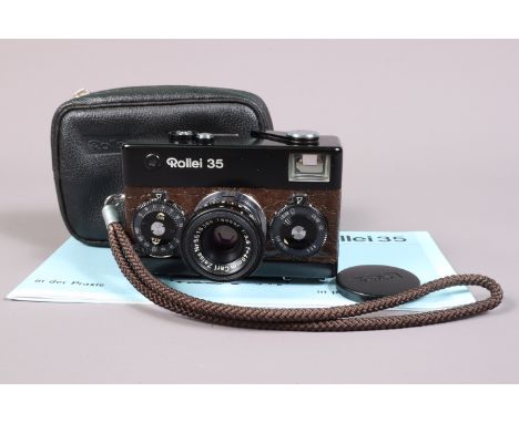 A Rollei 35 Compact Camera, black, brown, simulated Crocodile skin, made in Singapore, serial no 3268424, shutter working, me