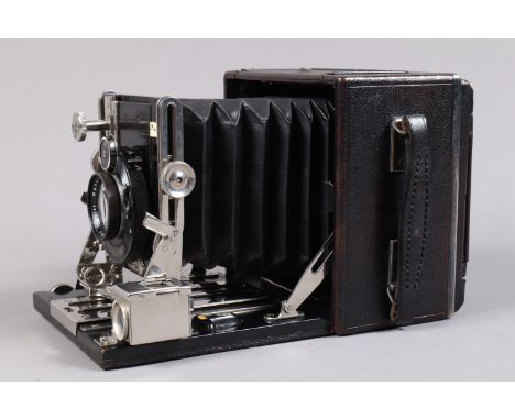 An Ensign Sanderson Regular Quarter Plate Field Camera, serial no 26158, circa 1930, body G-VG, wear to metal fittings, Compu