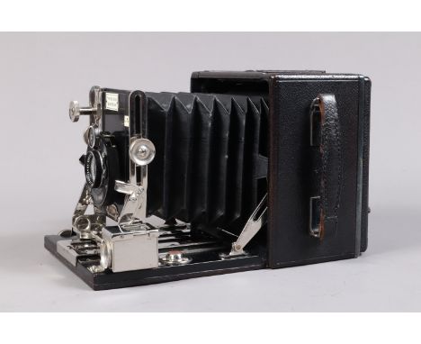 An Ensign Sanderson Regular Quarter Plate Field Camera, serial no 26223, circa 1930, body G-VG, wear to metal fittings, Compu