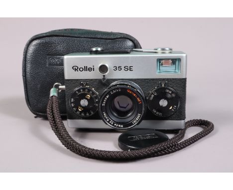 A Rollei 35 SE Compact Camera, chrome, made in Singapore, shutter working, meter untested, body G-VG, with Rollei HFT 40mm f/