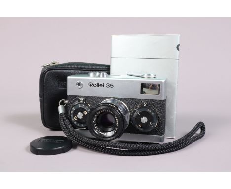 A Rollei 35 Compact Camera, chrome, made in Germany, serial no 3112713, shutter working, meter responsive, body G-VG, with Ca