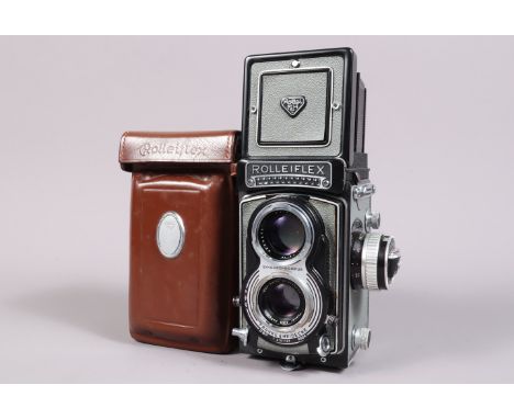 A Rolleiflex T TLR Camera, grey, with exposure meter, serial no T 2151127, shutter working, meter responsive, body G, some li