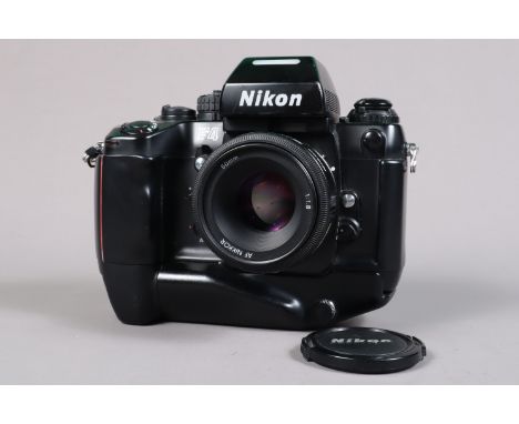 A Nikon F4 Camera, serial no 2424246, powers up, shutter working, appears to function as should, self timer working, meter re