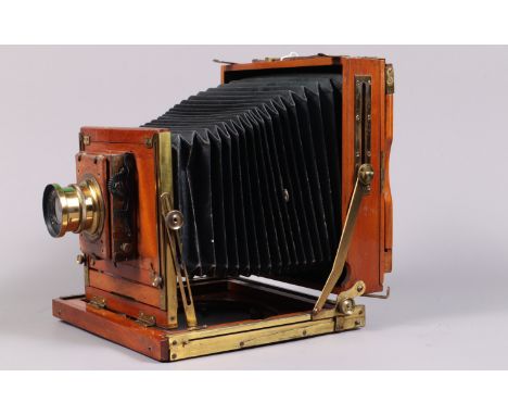 A Half Plate Mahogany and Brass Field Camera, tapered chamfered-corner black bellows, triple extension, focusing screen prese