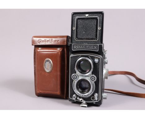 A Rolleiflex Automat TLR Camera,  model K4A, serial no 1427046, shutter working, body G, some brassing to strap lugs, some pa