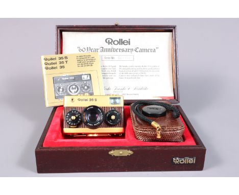 A Rollei 35 S 60 Year Anniversary Camera, gold plated, with brown lizard skin body, serial no 001105, body VG, shutter workin