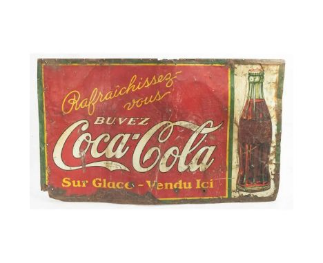 A large vintage Coca Cola tin advertising sign in French. The sign shows some character - it is bent, dented, dinged, creased