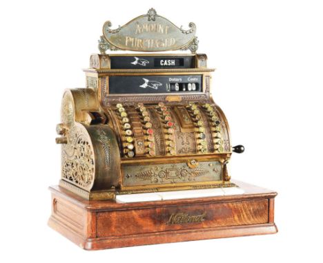 An original condition National model 452 brass cash register from Dayton, Ohio. This model has a hand crank and ticket receip