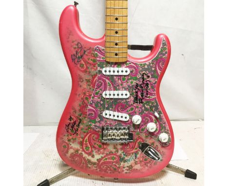 Fender Pink Paisley Stratocaster electric guitar signed by Elvis Presley’s band members: Reggie Young - Guitar, Ronnie Tutt -