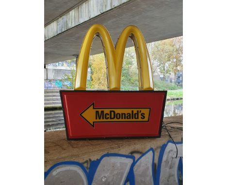 McDonald's light up sign with a directional arrow. In excellent working condition, with minor scuffs, requires 220V power. Si