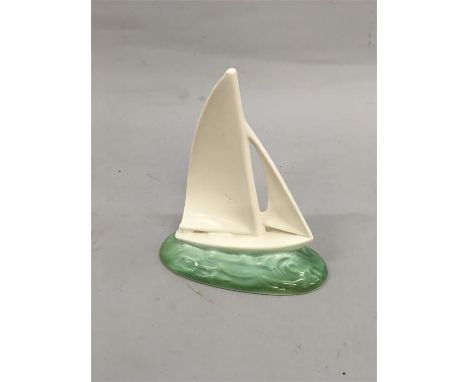 A Poole Pottery Yacht. Some restoration to the top of the sail.