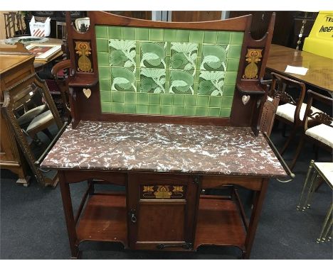  A good quality Victorian art Nouveau inlaid mahogany wash stand with tiles back in green to  depict  fishes ,marble top .and