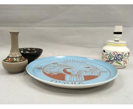 A collection of Poole Pottery (four pieces). (Plate has a crack in it).