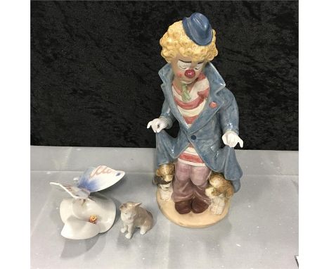 A Lladro figure "What a Surprise" figure together with a butterfly and a mini cat.