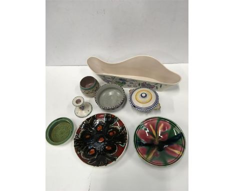 Eight pieces of Poole Pottery.