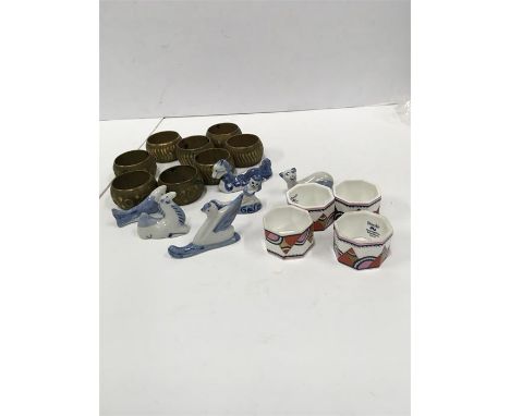 A set of 8 gilded napkin rings together with 4 Poole Pottery napkin rings and 6 rests for chopsticks.