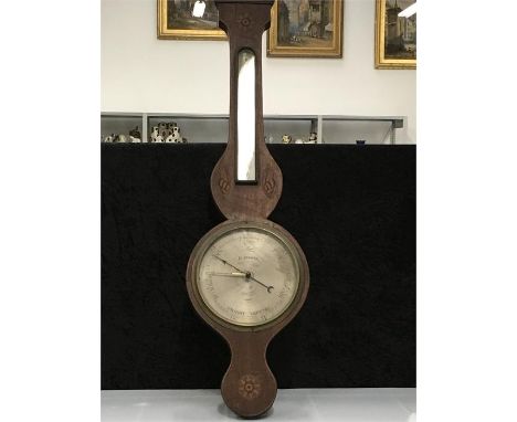 A Mohogany banjo barometer with shell inlay.