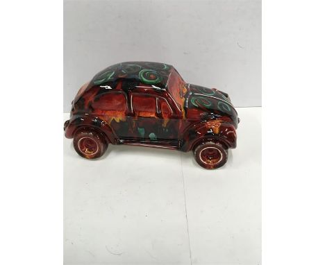 An Anita Harris Studio hand painted ceramic car.