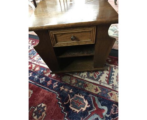 An oak Old Charm style coffee table/magazine rack with drawer and shelf under.