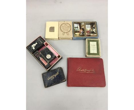 A mixed lot to include playing cards, nail kit and two autograph books.