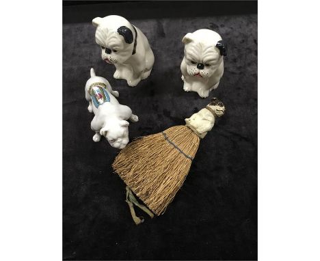 A pair of 1920's china Bulldogs and a crested ware Bulldog together with a celluloid model of a Bulldog on original brush.