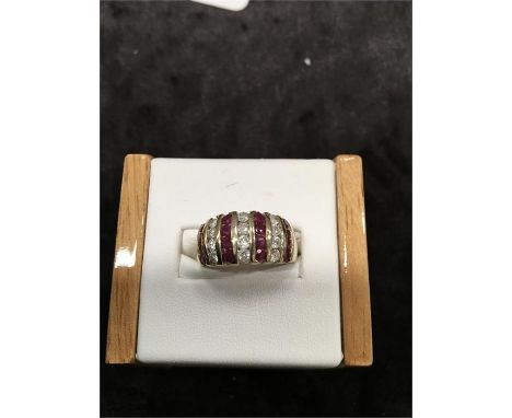 A Diamond and Ruby ring set in 9ct gold.