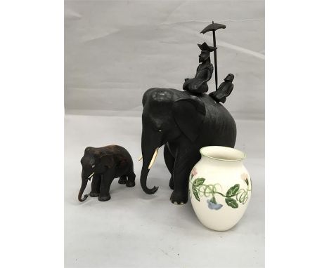 Two carved wooden elephants together with a Poole Pottery jug.