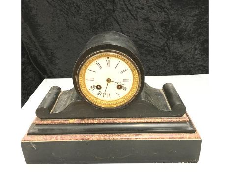 A nineteenth century black slate mantle clock.