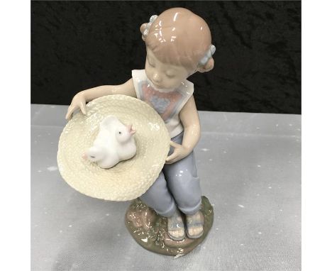 A Lladro figure (SURPRISE) boxed.