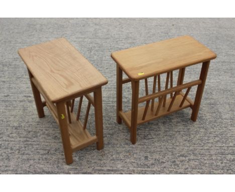 A pair of light oak magazine stands, on shaped supports, 17" wide x 9 1/2" deep x 16 1/2" high, and a smaller similar rack 