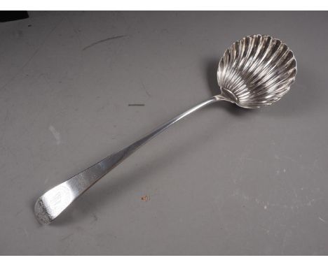 A Georgian silver shell bowl bottom marked ladle, 5oz troy approx 
