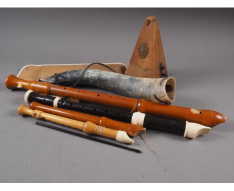 A vintage Maelzel wooden cased metronome, 9" high, four recorders and a horn, 15 1/2" long 