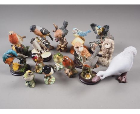 A Beswick model stonechat, a Beswick greenfinch, three other Beswick model birds, and a quantity of other ceramic and resin b