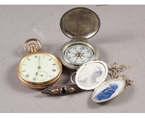 A rolled gold cased open faced pocket watch, a nickel cased pocket compass, a silver locket, on chain, and a silver navette s