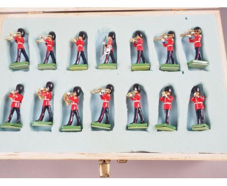 A Britains painted lead figure "46 PC Marching Band", in a two-tier wooden case, and a W Britain Limited Edition "Band of the