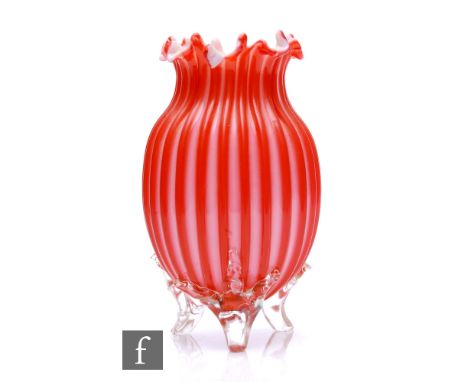 A late 19th Century Stourbridge glass vase of swollen ovoid form with deep ribbed body in tonal ruby below a sheered rim over