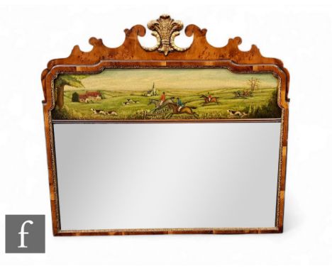 A 19th Century walnut veneered wall mirror, with carved fretwork top and central Prince Of Wales feathers gilt pediment, furt