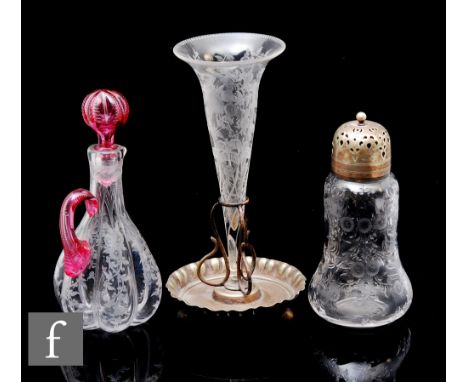 A late 19th Century Stourbridge crystal glass oil bottle of lobed form with applied pink handle and matched lobed stopper, en