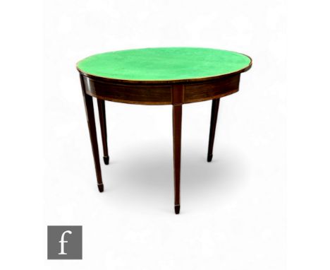 A George III mahogany card table of demi-lune form, with inlaid banding, the hinged top revealing with a baize, raised on tur