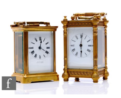 A late 19th Century French brass carriage clock with key, white enamelled dial, pierced fret pillar border, height 12cm, and 